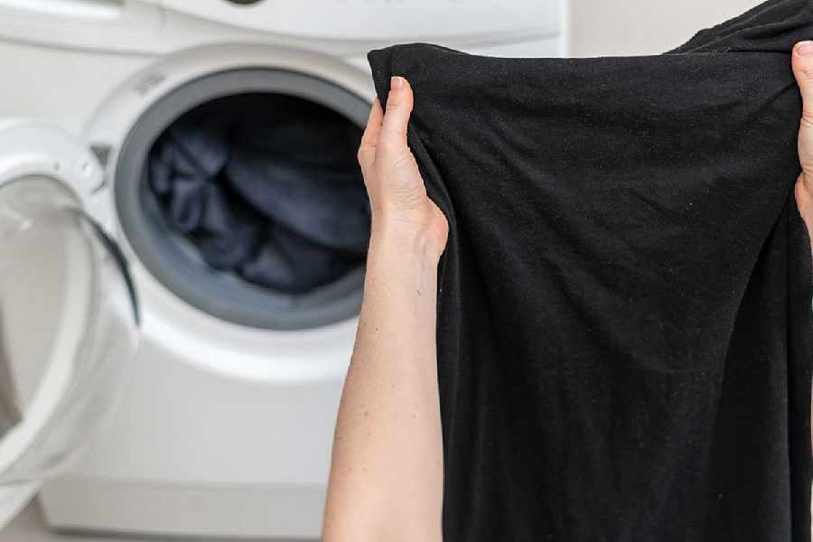 Two household items could stop black clothes from fading in the wash
