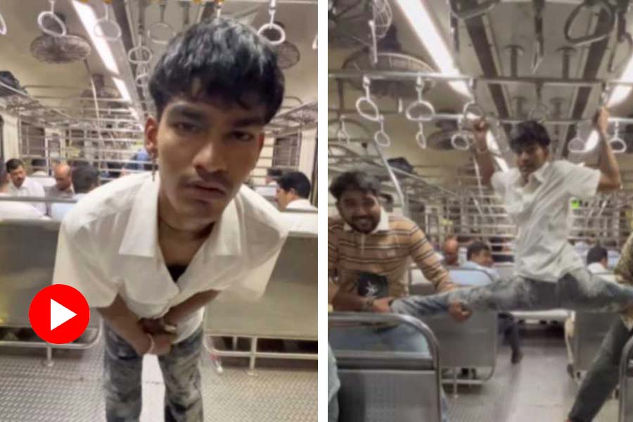 youth performing a weird stunt inside a coach of the mumbai local train