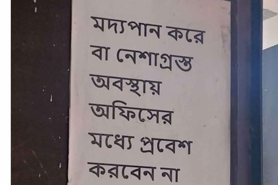 সুজয় হাজরার বাড়ির দেওয়ালে থাকা পোস্টারে আলাদা করে চোখ আটকাবেই।