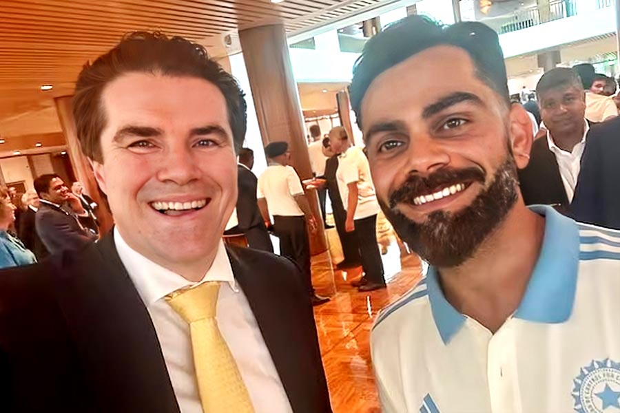 PIcture of Tim Watts and Virat Kohli