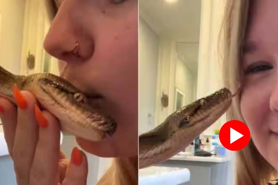 Woman kissing on snake head, video goes viral