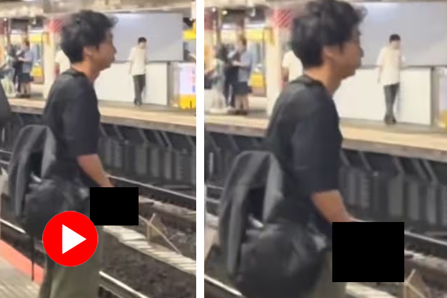 A man urinating on the subway tracks has sparked outrage on social media