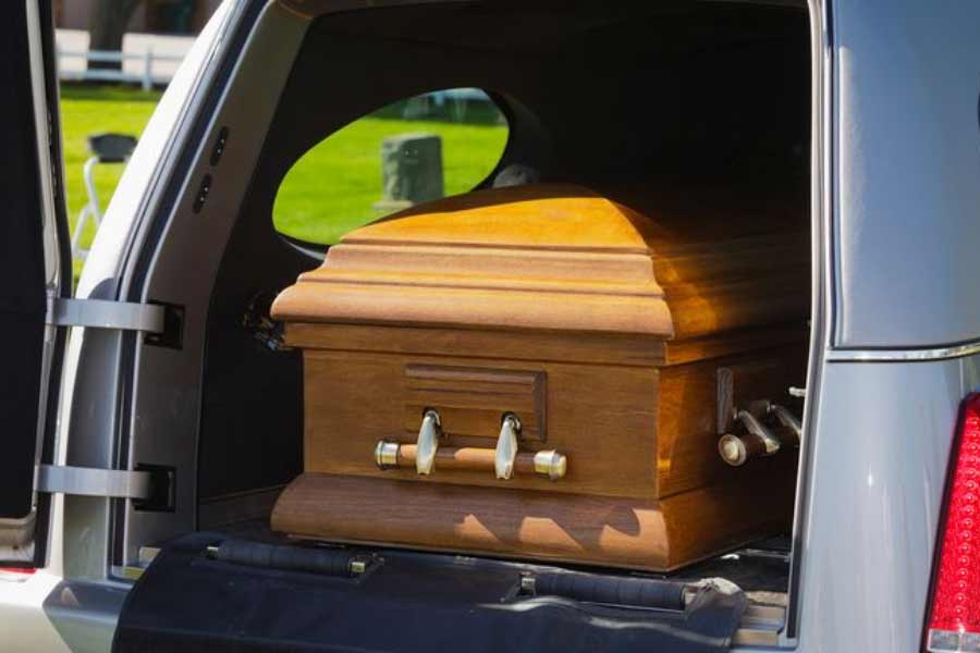 A corpse was transporting fell out of a hearse and into traffic