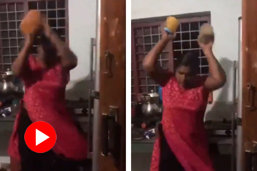 Video shows angry wife smashes things, kids and husband look from distance