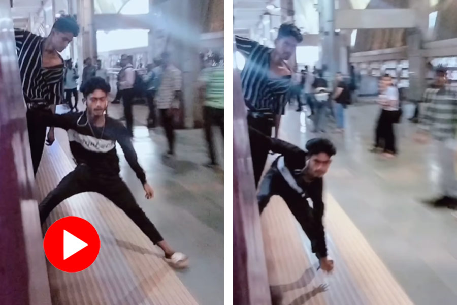 Man performs dangerous stunts with moving train