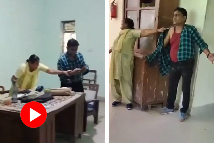 A professor is being beaten up by his wife in his university