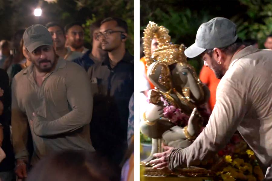 Salman Khan holds his injured ribs while dancing during the Ganesh visarjan