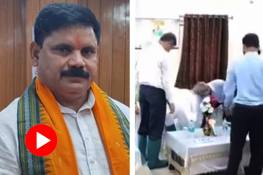 Viral Video Shows govt officer removes shoe of central minister