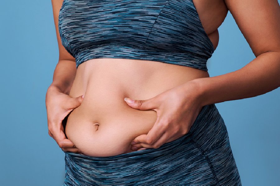 Why do women gain weight around the abdomen