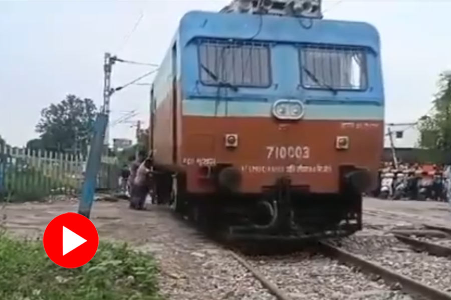 Train engine pushed by railways employees manually at Bijnor in Uttar Pradesh