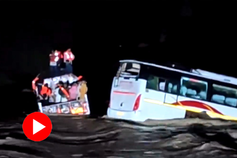 A bus inundated in the floodwaters, got stuck on the road in Gujrat