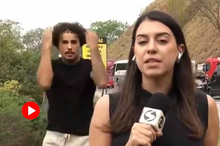 Man comes running to get filmed on live TV, dances as journalist reports in Rio De Janeiro