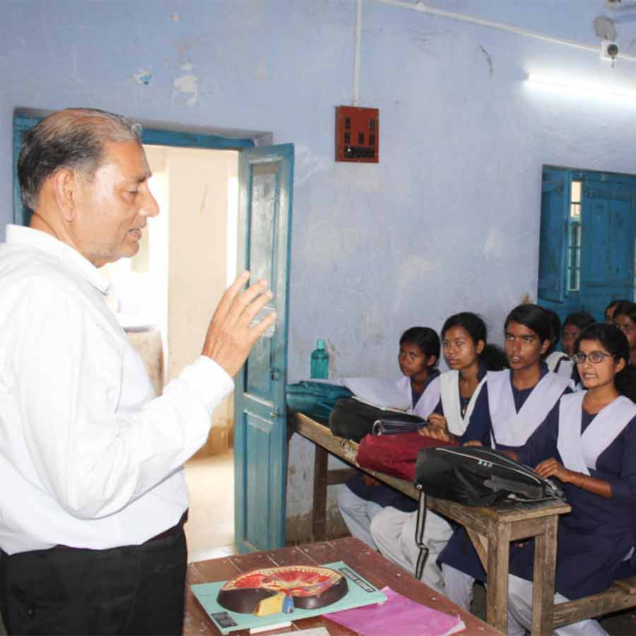 A retired teacher still comes to school to take classes
