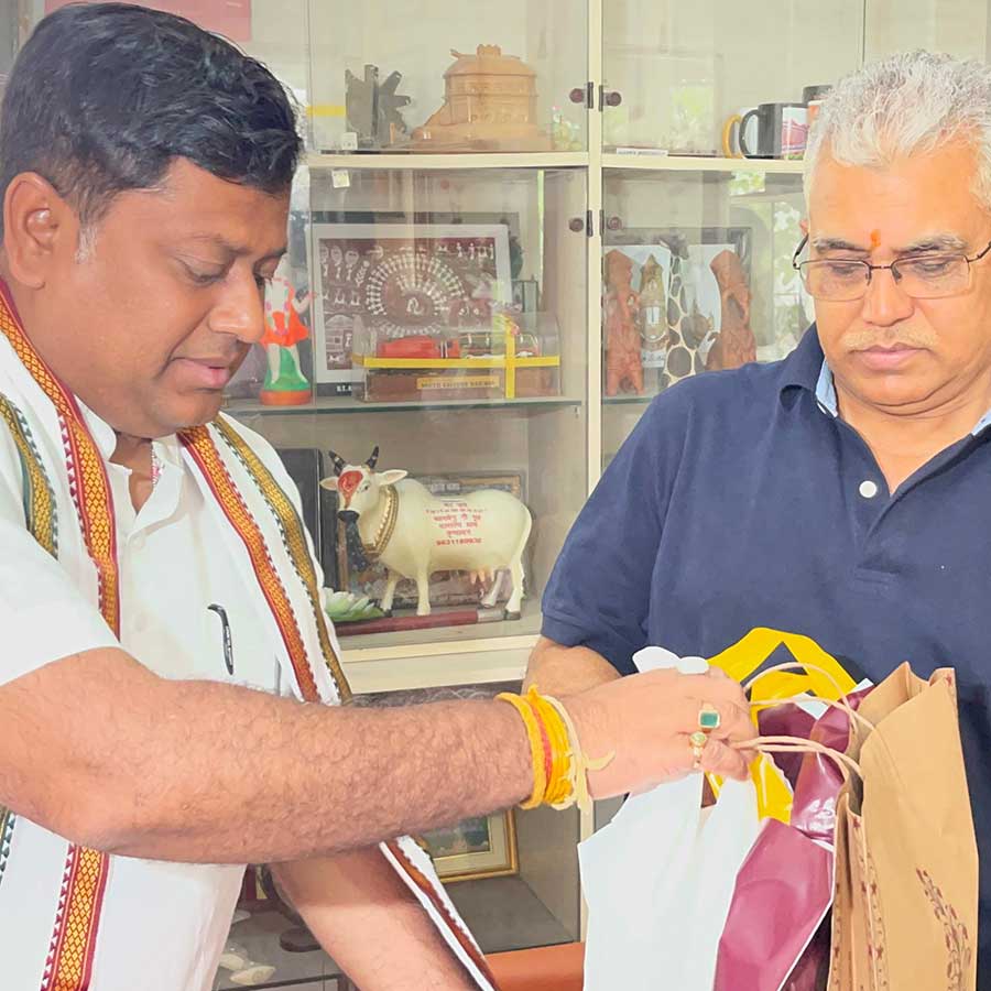 BJP West Bengal President Sukanta Majumdar gifts a dhoti to Dilip Ghosh on his wedding dgtl