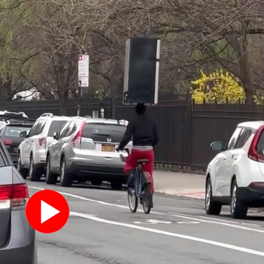 Video shows man riding cycle keeping a fridge on head