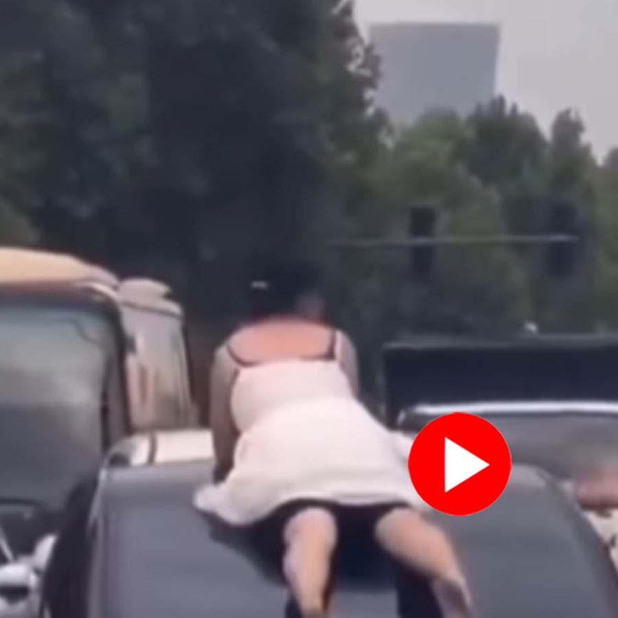 Video of woman in China climbing on several cars goes viral dgtl