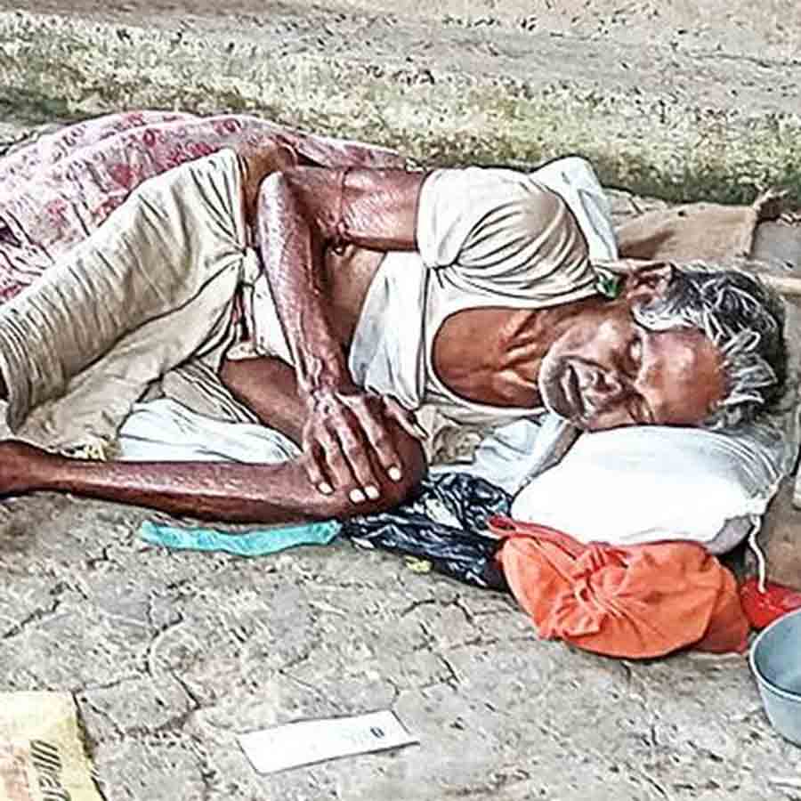 A sick and aged man was abandoned by his son seen resting on road