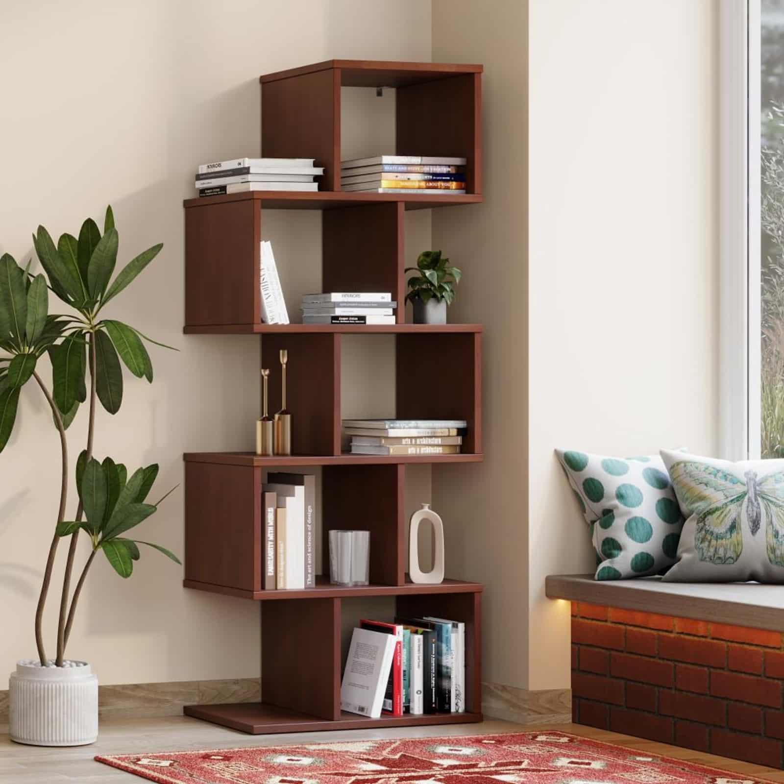 বই পড়তে ভাল বাসলে বসার ঘরে রাখতে পারেন কোনও বইয়ের তাক। এতে দেখতেও সুন্দর লাগবে আর কোনও অপেক্ষমান অতিথি চাইলে তাক থেকে বই বের করে পড়তেও পারবেন। 