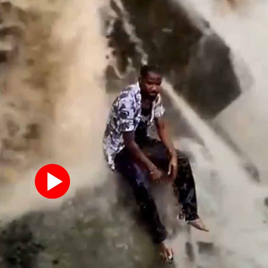 man swept away while filming under waterfall