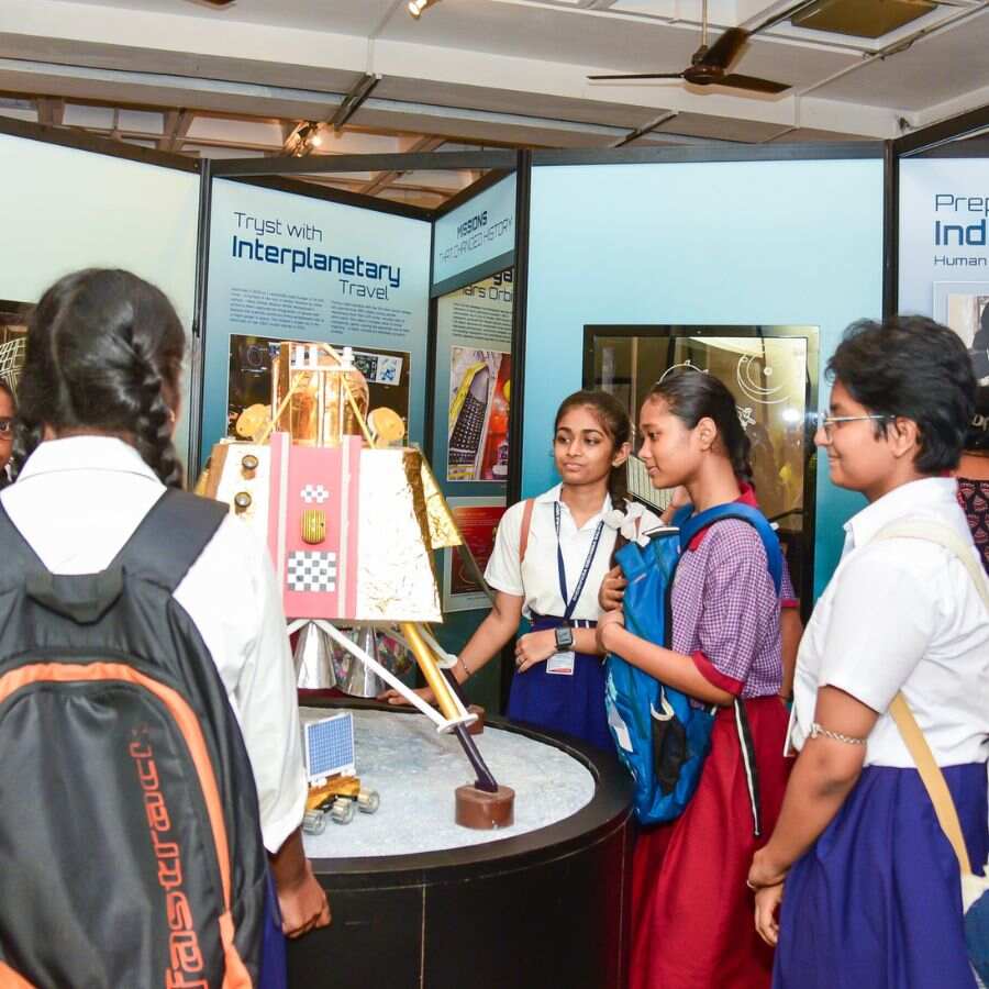 Students look at a rocket model on National Space Day at the Birla Industrial and Technology Museum.