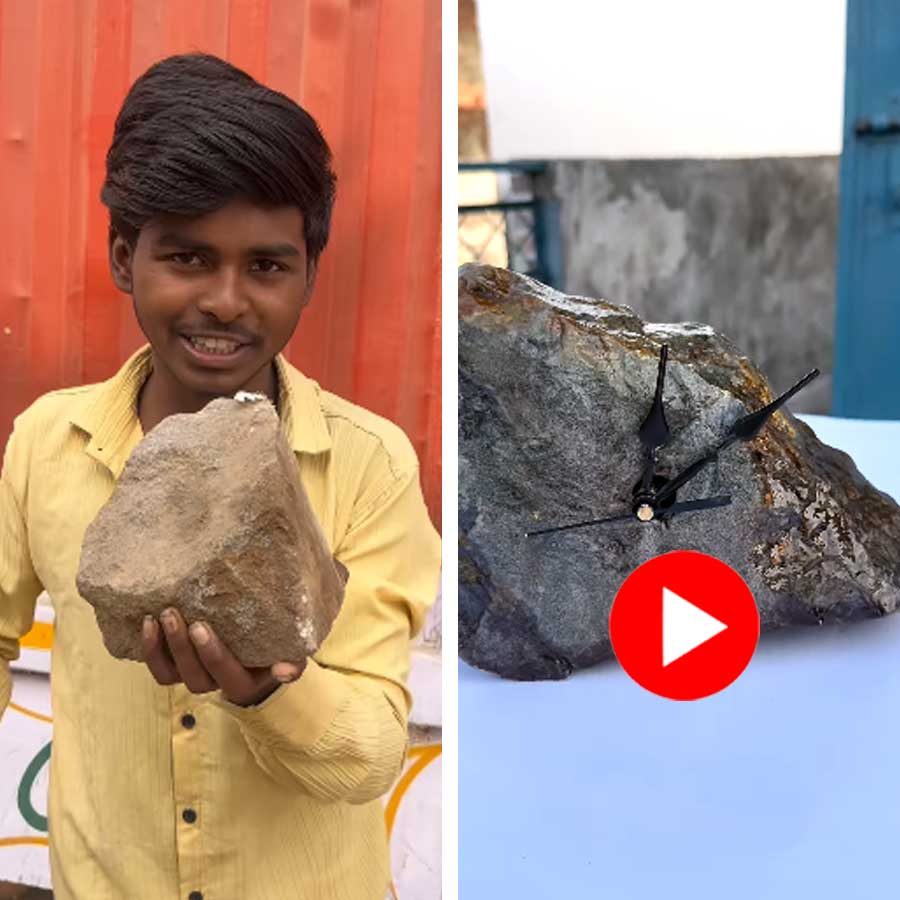 young man managed to turn a plain roadside stone into a clock