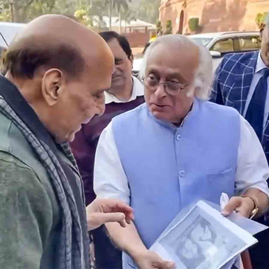Congress Leader Jairam ramesh Gifts a book to Defense Minister Rajnath Singh