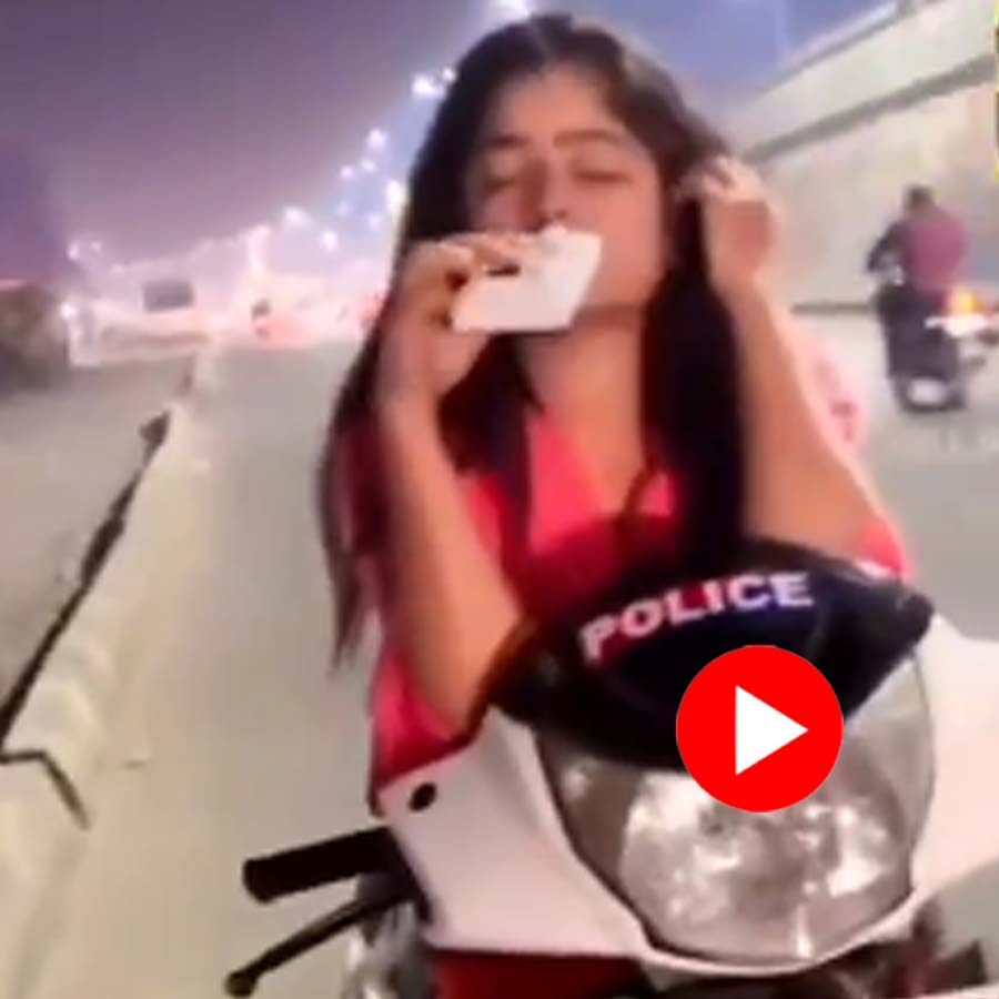 Video shows Woman sits on Scooty with Police sticker, drinks alcohol in public