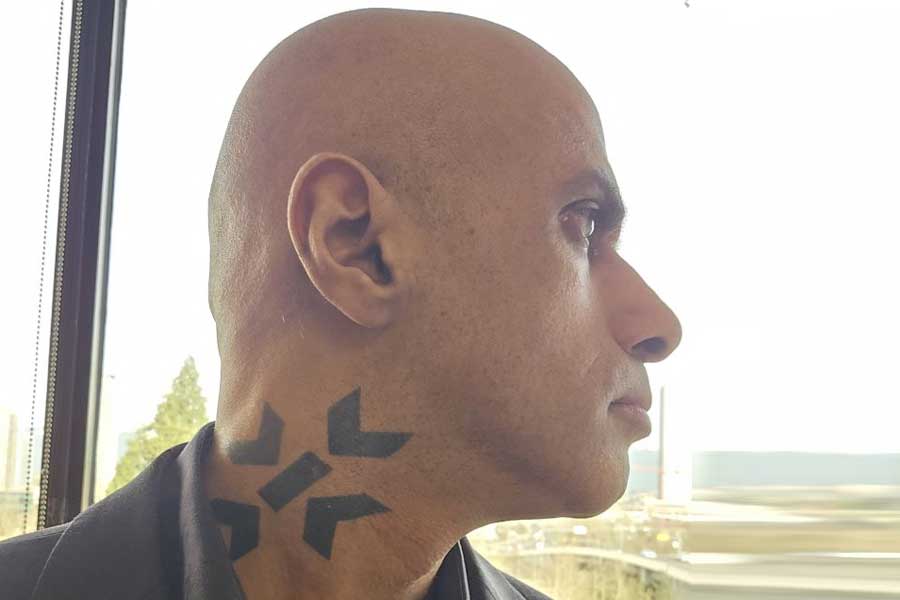 Man gets company logo tattooed on his neck after serving it for 25 years dgtl
