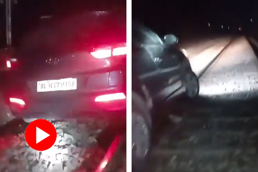 Video of a drunk man drives car on Rail track in Uttar Pradesh