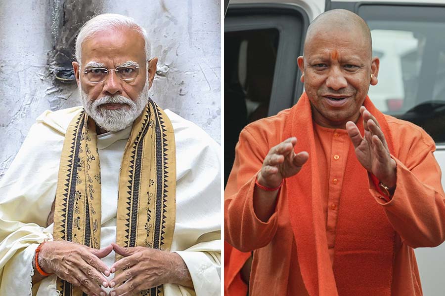 PM Narendra Modi stood beside Yogi Adityanath and slammed critics of Maha Kumbh 2025