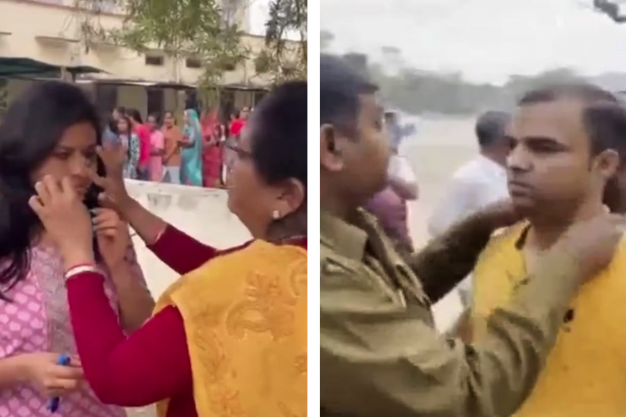 পরীক্ষাকেন্দ্রের বাইরে চলছে তল্লাশি।