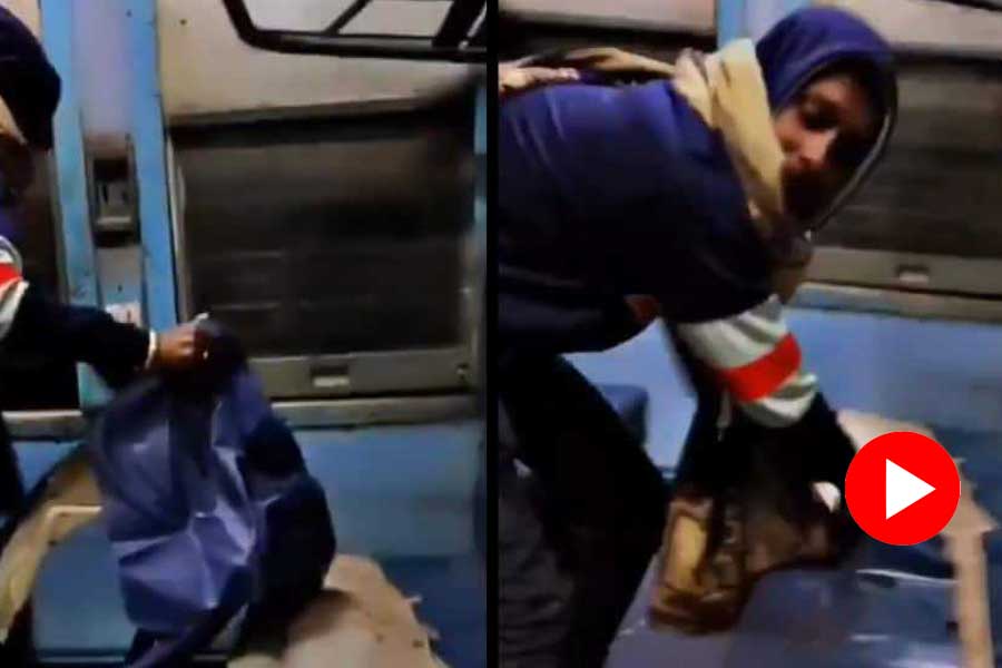 Viral video of a man is seen tearing a seat cover inside rail coach and throwing it out of the window