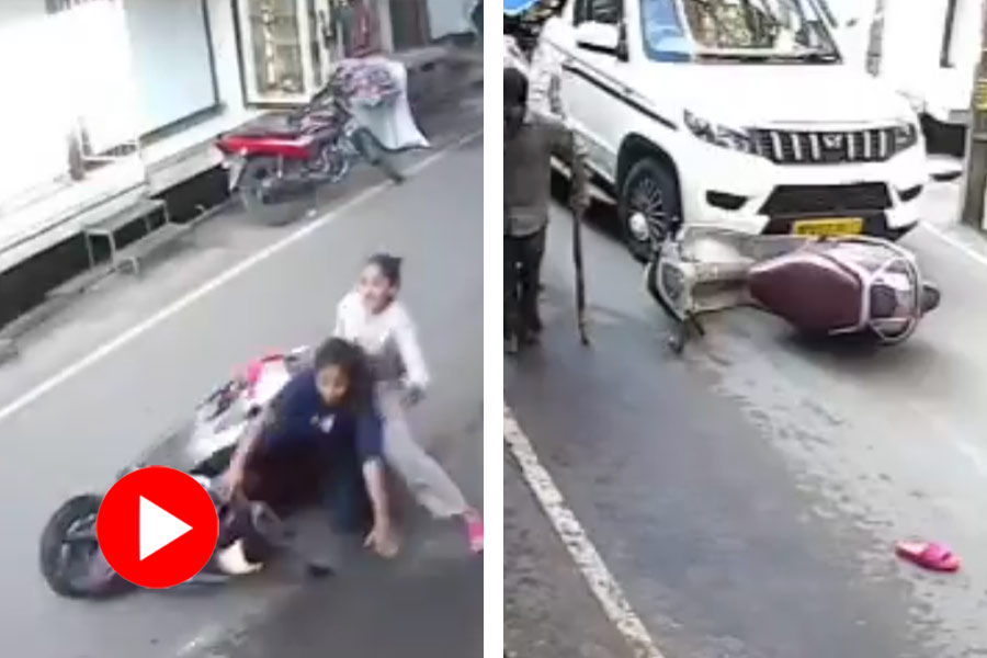 Viral cctv footage of two women falling off from scooter, narrowly escapes a mishap