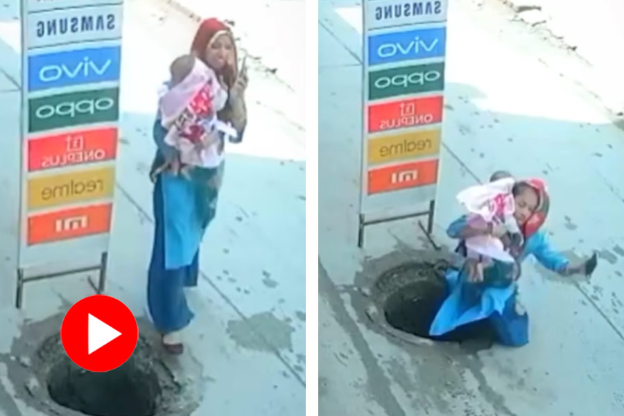 A video of woman with a baby in her lap was spotted falling into an open manhole went viral