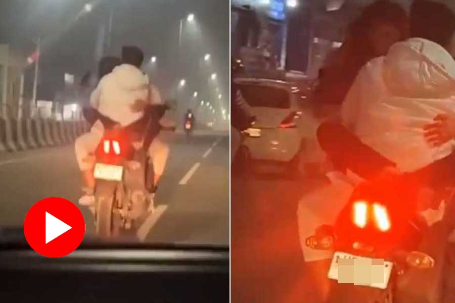 A viral video of couple is seen performing dangerous stunts while riding a speeding bike