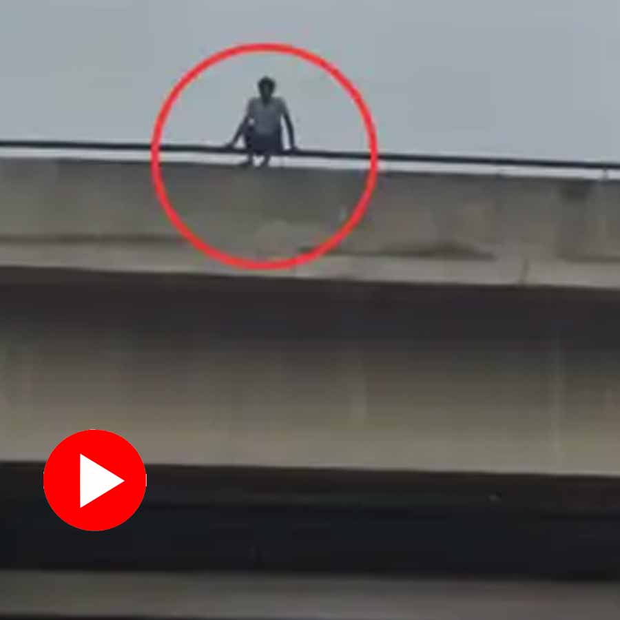 Police saved a Young man climbed on the flyover
