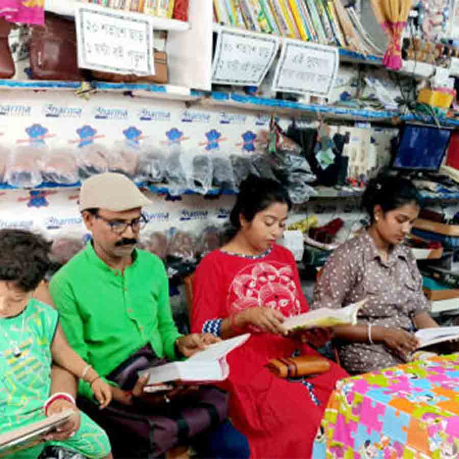 A bookseller from Bangaon giving discount to those customer who come in his shop and read books