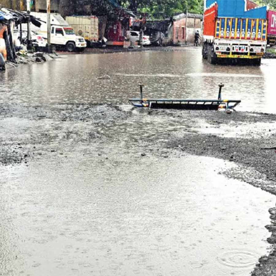 It is difficult to understand the potholes in the road due to accumulated water