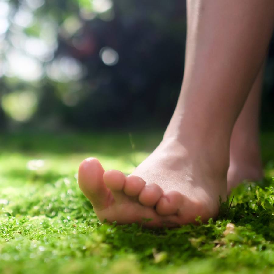 5 benefits of walking barefoot on the  grass in the morning dgtl