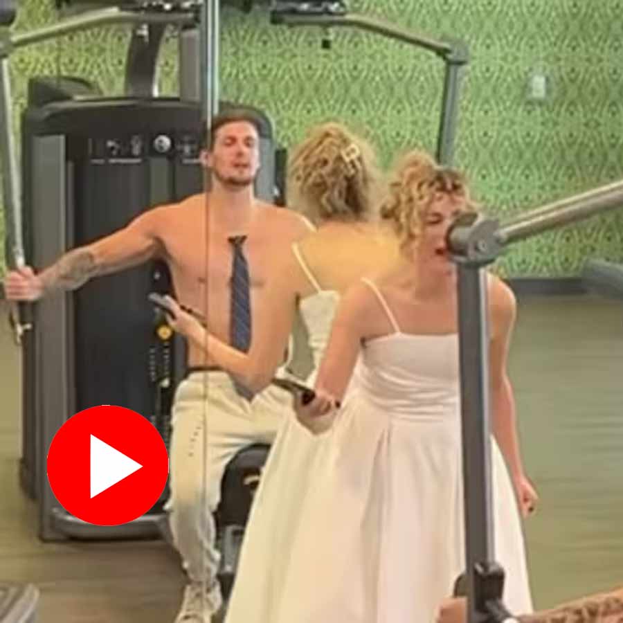bride crying, while the groom remains focused on his workout
