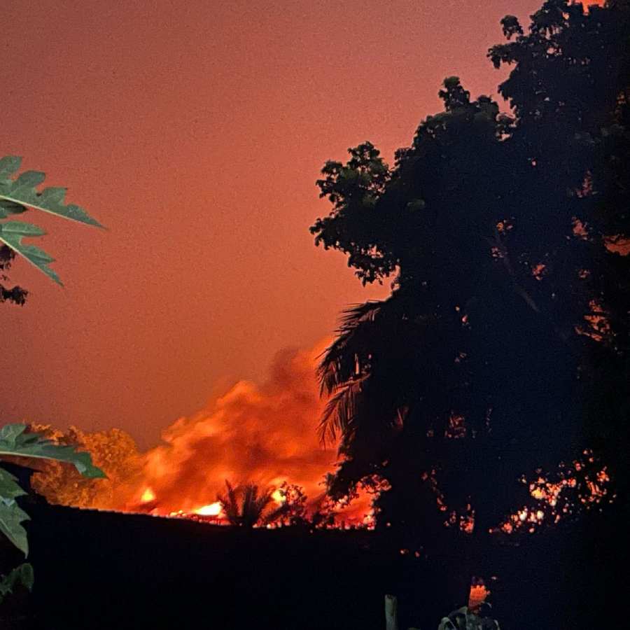 Several fire engines are working to put out the fire at a factory in Barasat