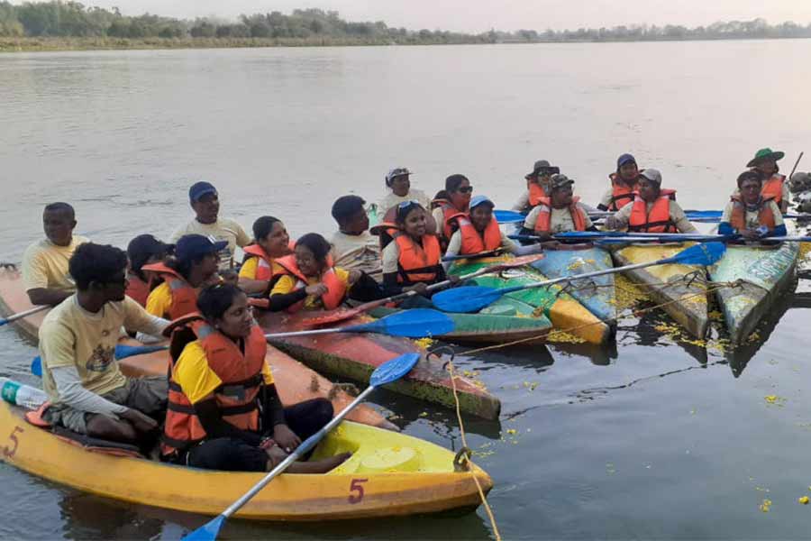 A group of women on campaign to protect river by riding on a kayak