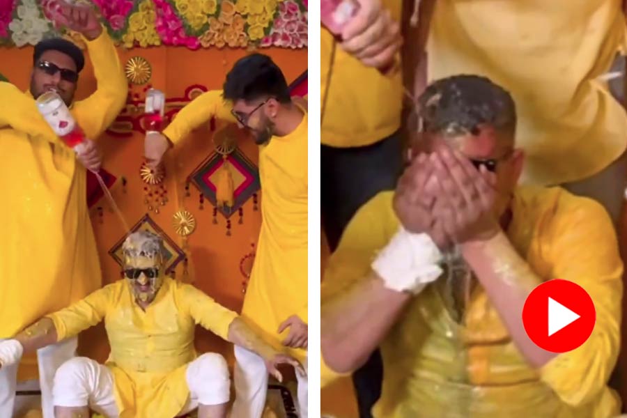 friends showered bottles of alcohol on the groom