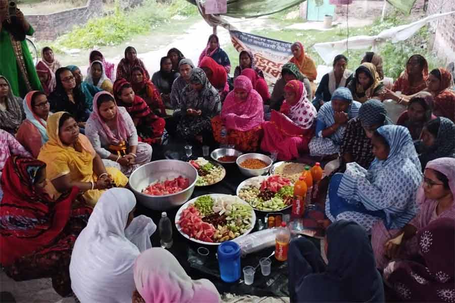 Women Workers of a Textile Industry celebrates Iftaar with others after getting the money of Provident Fund