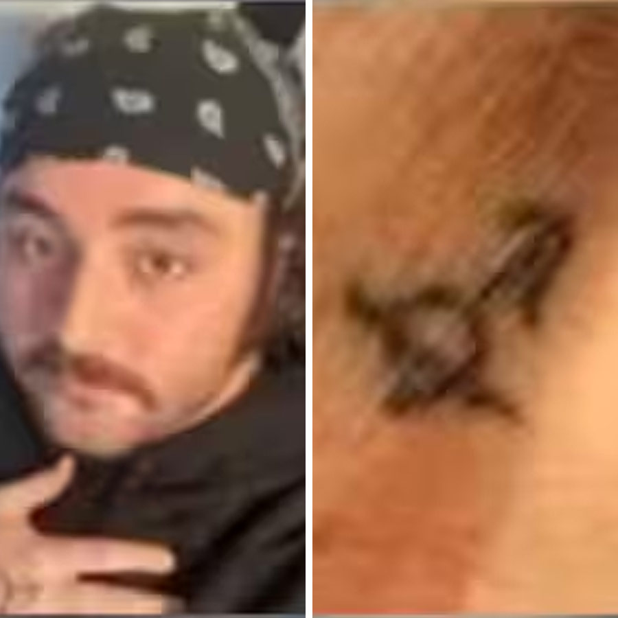 man adopted a stray dog and tattooed its mark on hand