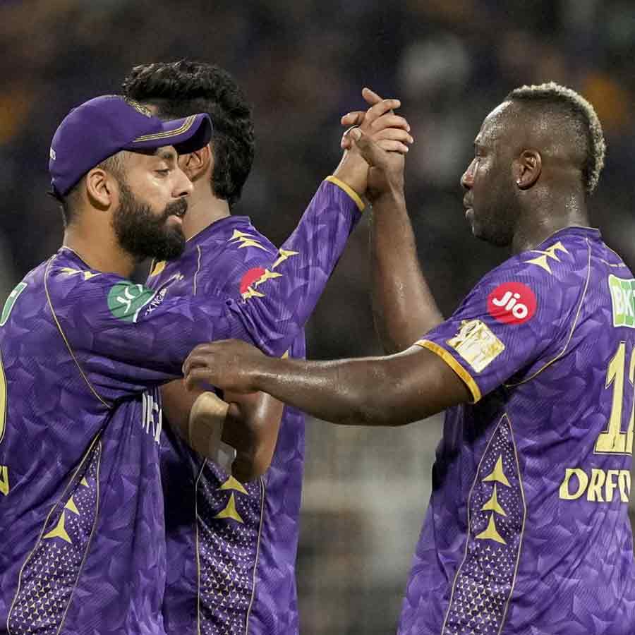 Varun Chakravarthy and Andre Russell