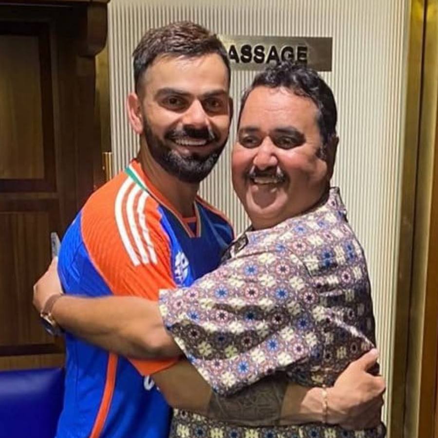 Picture of Virat Kohli and Rajkumar Sharma