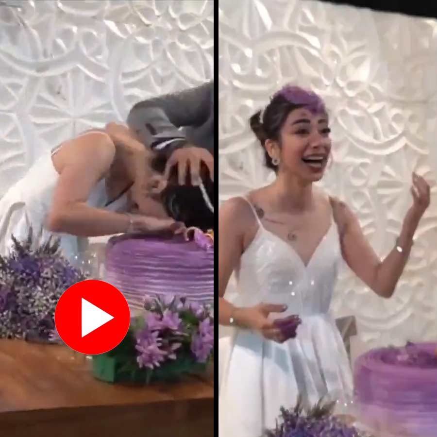 Video of groom doing prank with wedding cake with bride dgtl