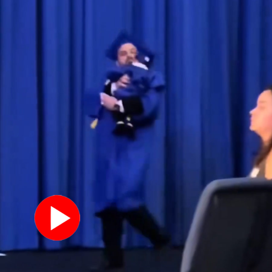 Video shows man runs to collect graduation degree holding son, police chased him