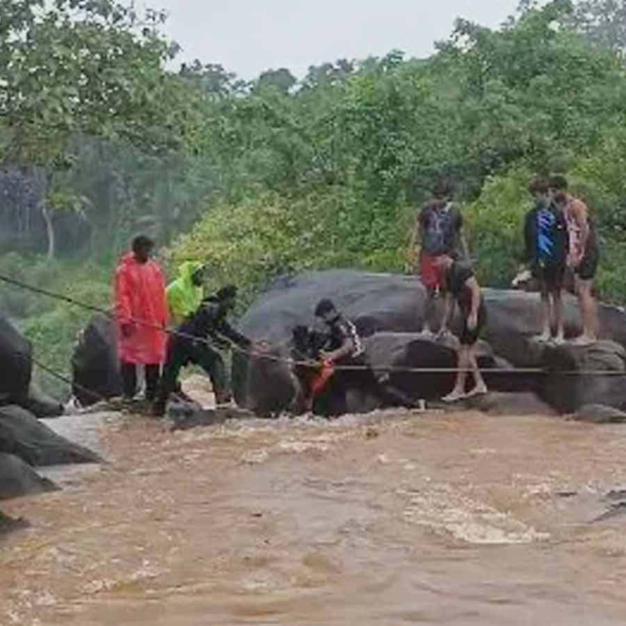 several tourists stuck atop waterfall in Karnataka amidst heavy rainfall, rescued by locals dgtl